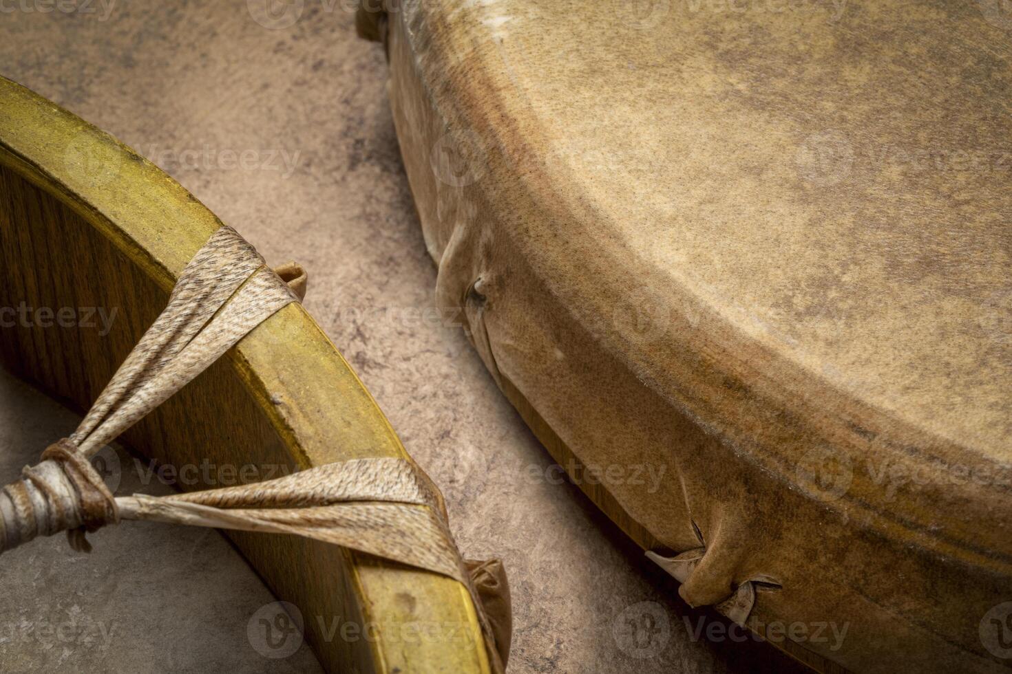 two handmade, native American style, shaman frame drums covered by goat skin photo