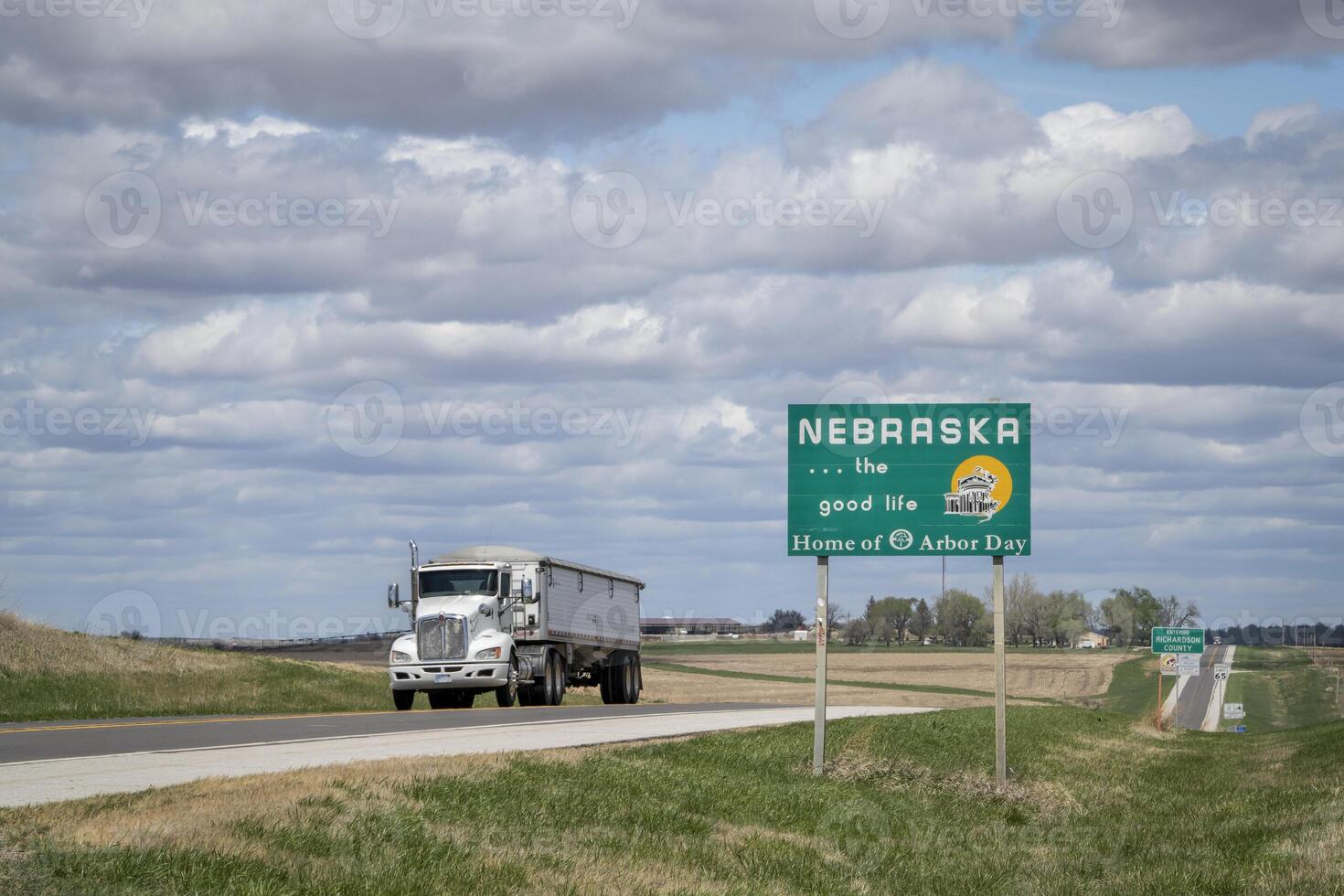Nebraska, the good life, home of Arbor Day - roadside welcome sign at state border with Kansas, spring scenery photo