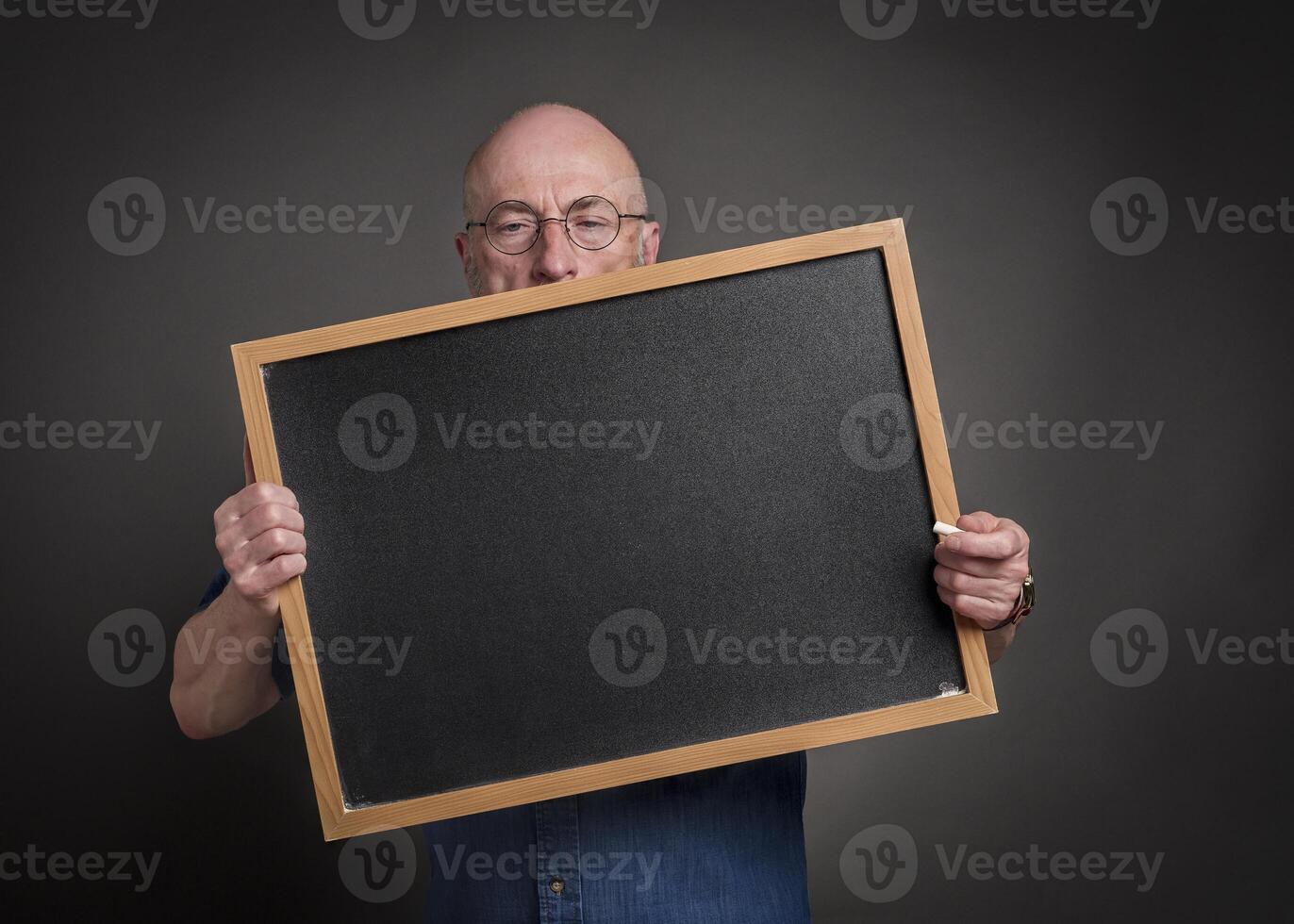 senior man, teacher, mentor or presenter, with blank blackboard, education, presentation and business communication concept photo