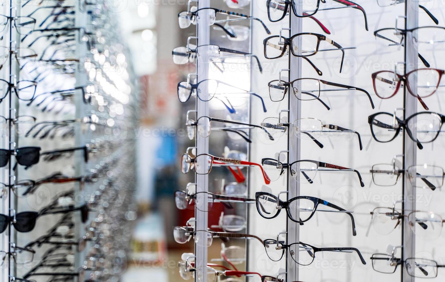 Various spectacles on display in optical store photo