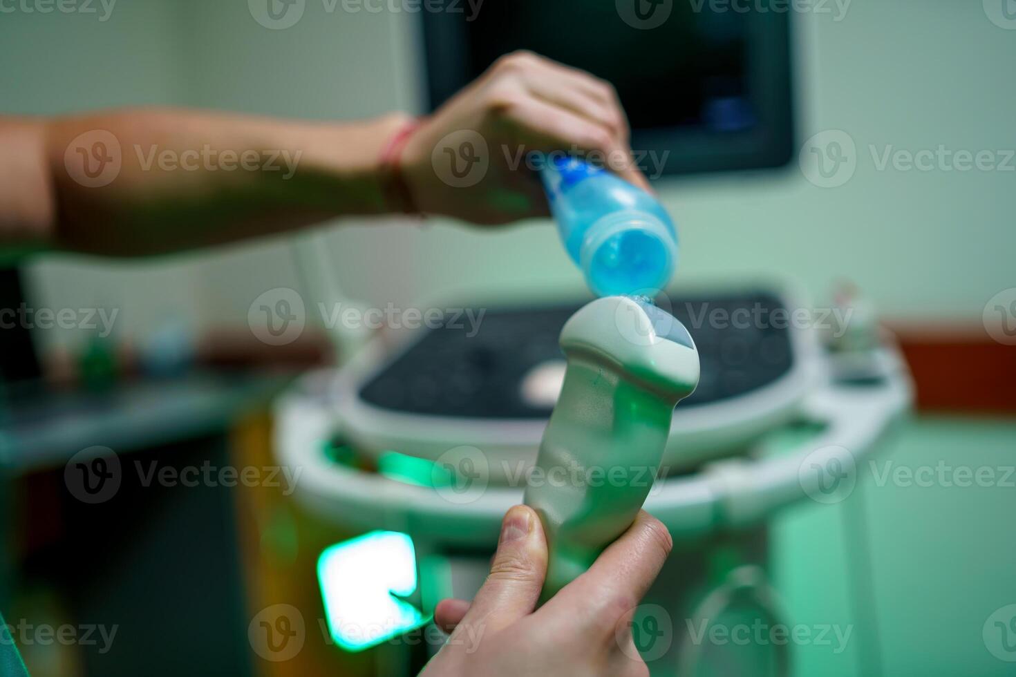 Ultrasonography USG . Hand holding ultrasound probe and coupling gel prepare for diagnostic. photo