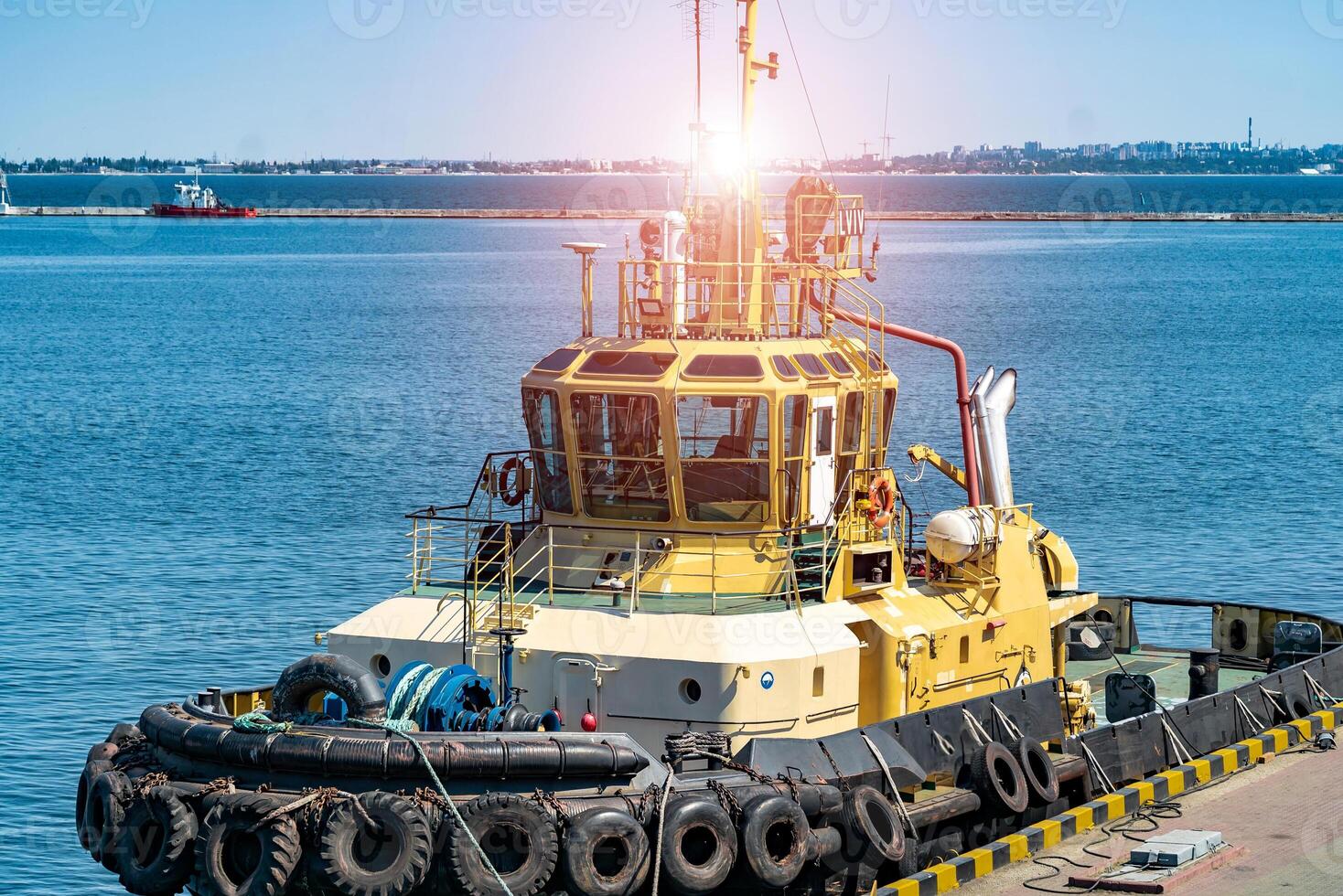 Industrial port. Special sea technic in port. Trade port scene at blue sky background. photo