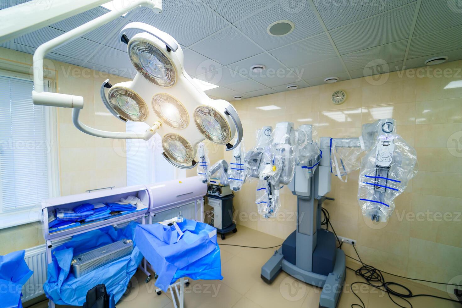 Surgical room in hospital with robotic technology equipment, machine arm surgeon in futuristic operation room. Minimal invasive surgical innovation, medical robot surgery with endoscopy photo