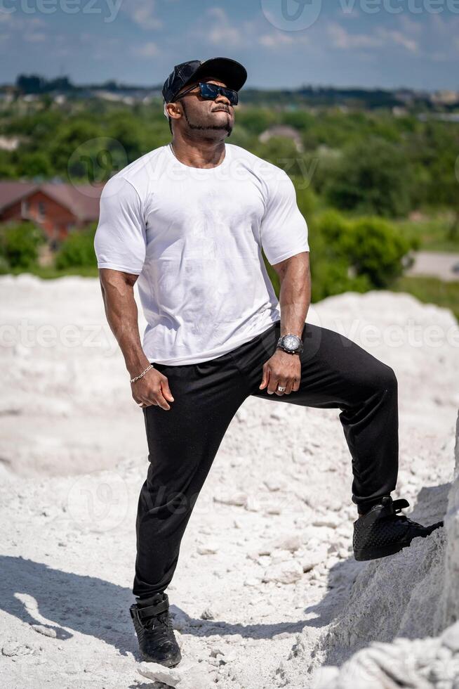 Attractive stylish man in white shirt posing for camera. Elegant young lifestyle guy. photo