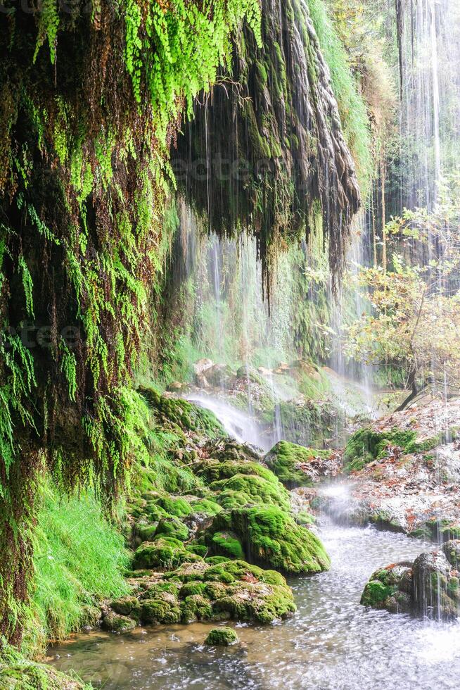 Kursunlu waterfall with clear water in the lake. View of Kursunlu Waterfall in Antalya, flowing from high mountain. photo