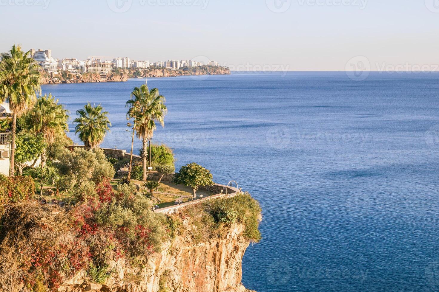 Breathtaking Cliffside View of the Mediterranean Sea with City Skyline. Antalya, Turkey photo