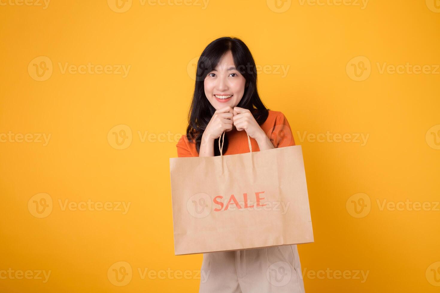 Elevate your shopping experience with the shock of the best deals. Smiling woman reveals her purchases, embodying the joy of finding incredible savings. photo