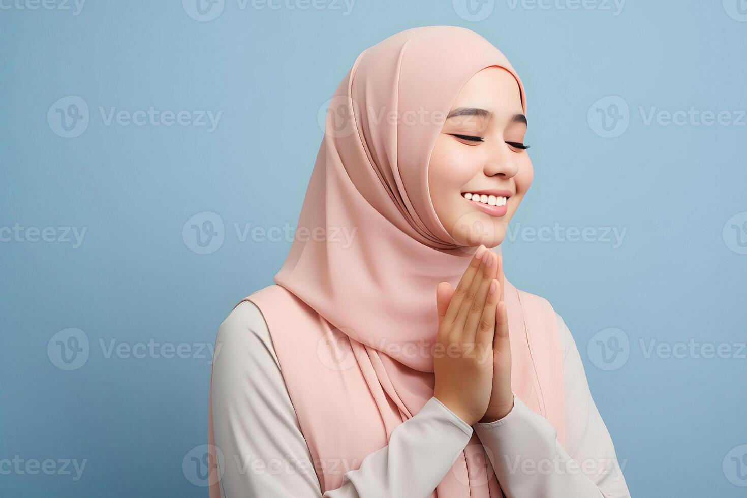 AI generated Beautiful Asian Muslim woman with a radiant smile, making an Eid Mubarak greeting gesture, isolated on a clean background, representing the concept of religious lifestyle photo