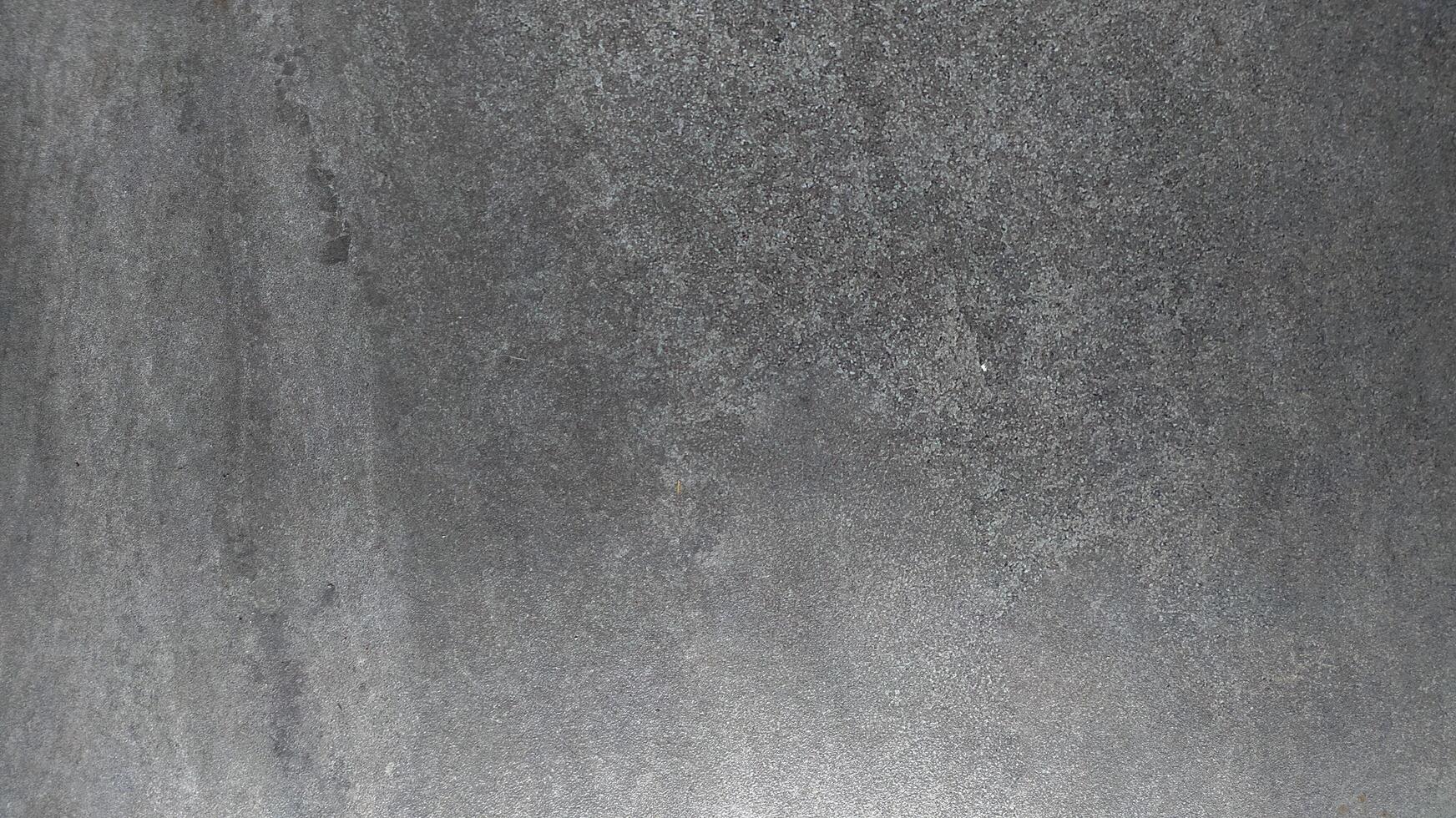 a gray concrete wall with a smooth texture on the wall photo