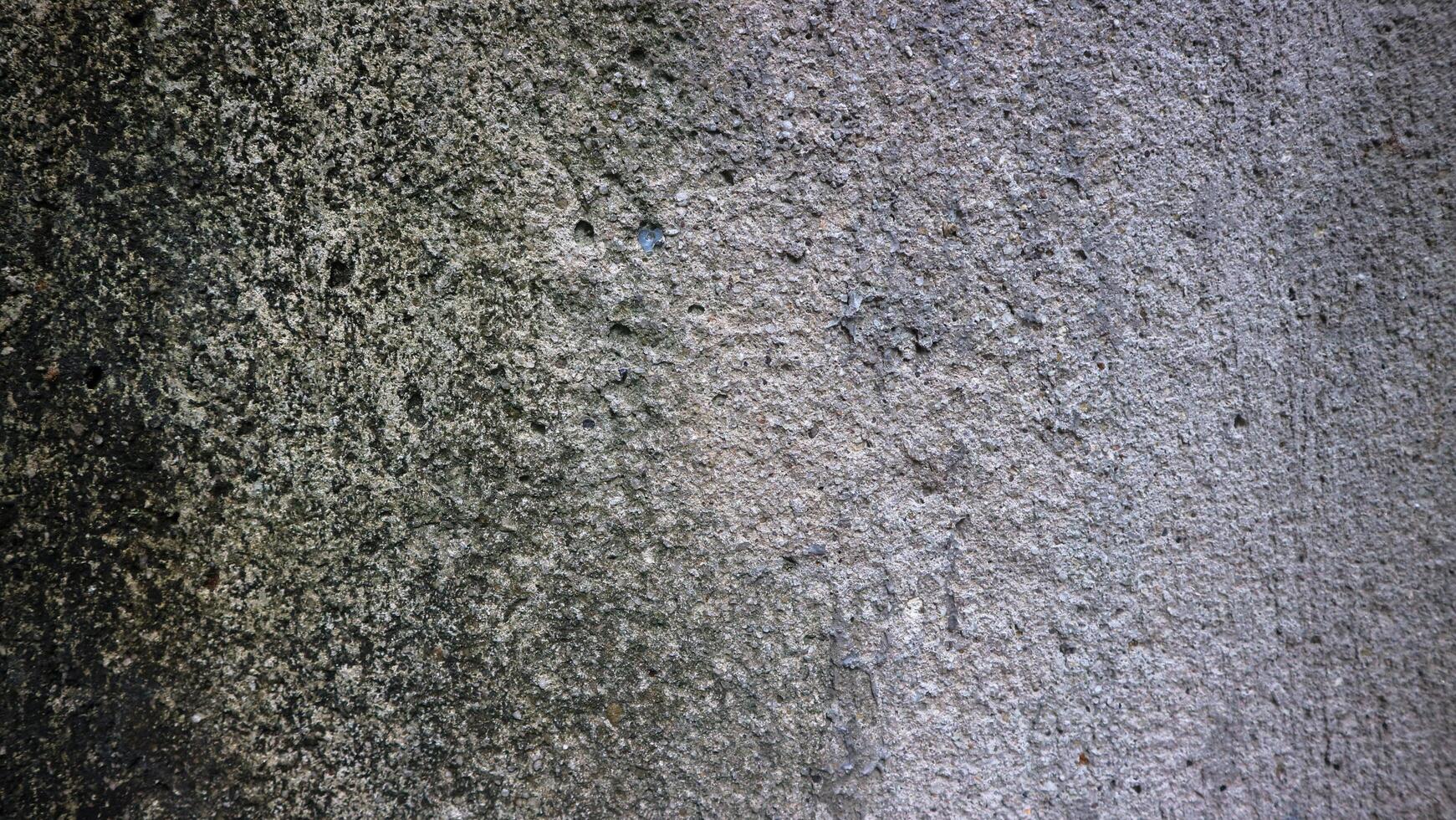 a gray concrete wall with a rough texture photo