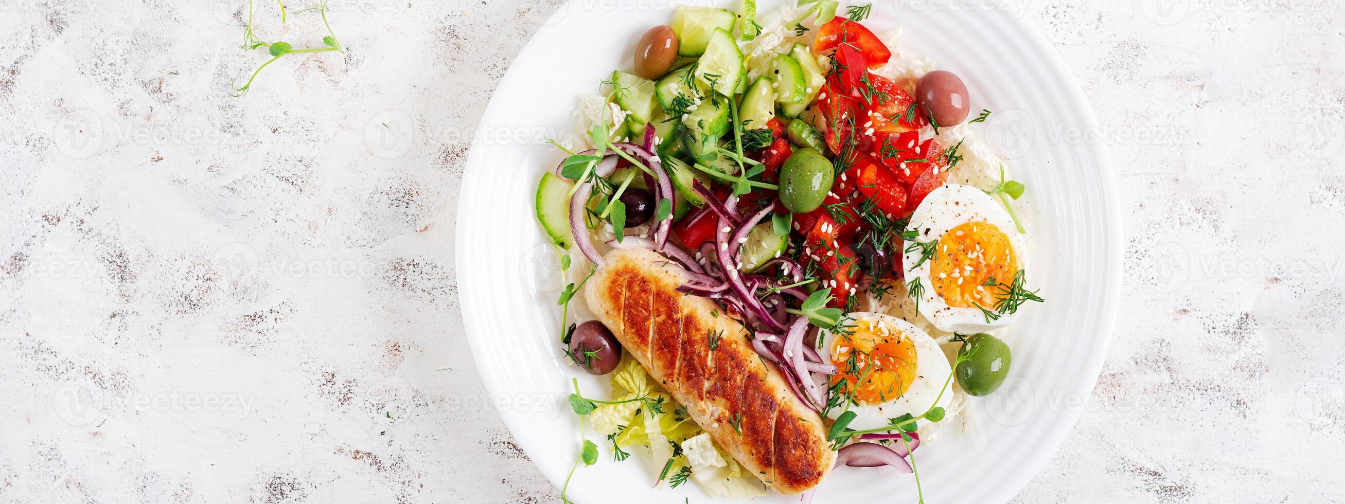 Breakfast homemade chicken sausage with boiled egg and fresh salad. Keto, ketogenic breakfast. Trendy breakfast. Top view, banner photo