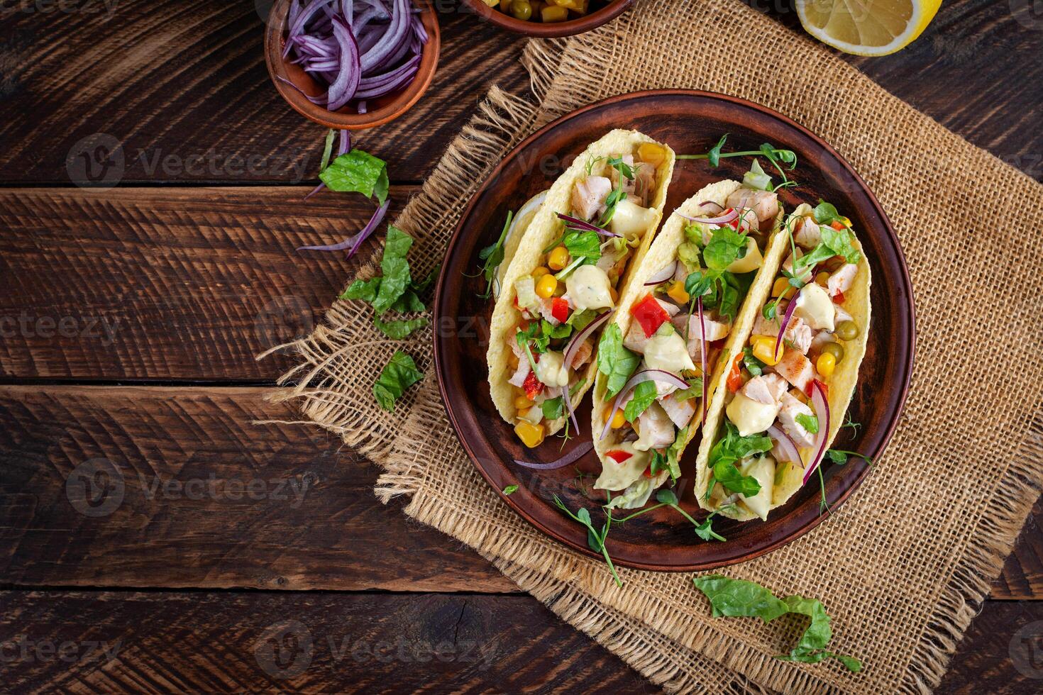 Mexican tacos with chicken meat, corn and salsa. Healthy tacos. Diet menu. Mexican taco. Top view, flat lay photo