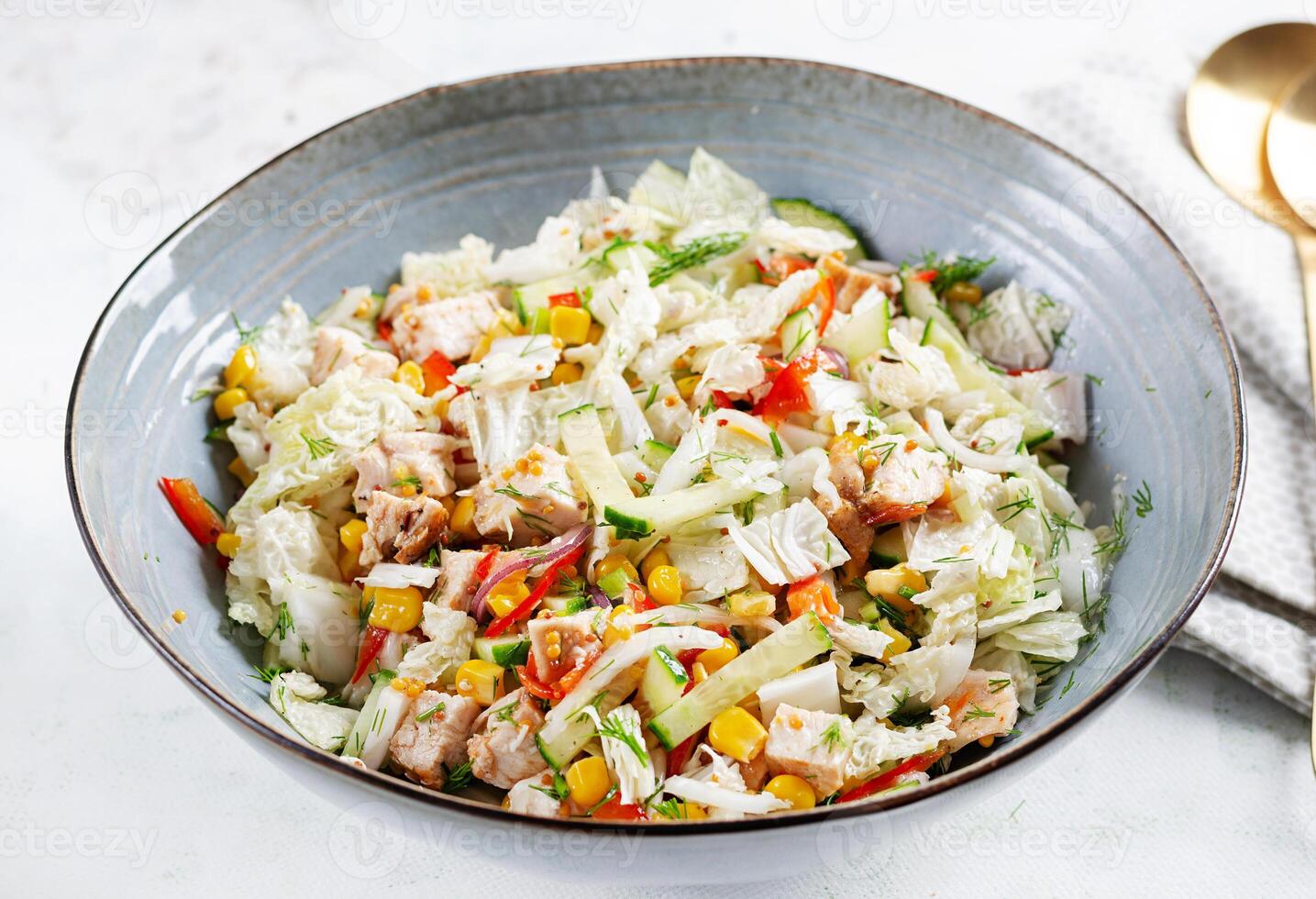 Chinese cabbage salad with chicken meat, corn, cucumber and dressing mustard. Asian food. photo