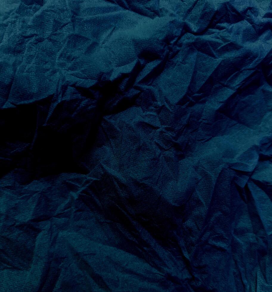 Abstract creased or wrinkled or crumbled paper texture background, Old and stained paper with grainy and wrinkled or crumbled stains. photo