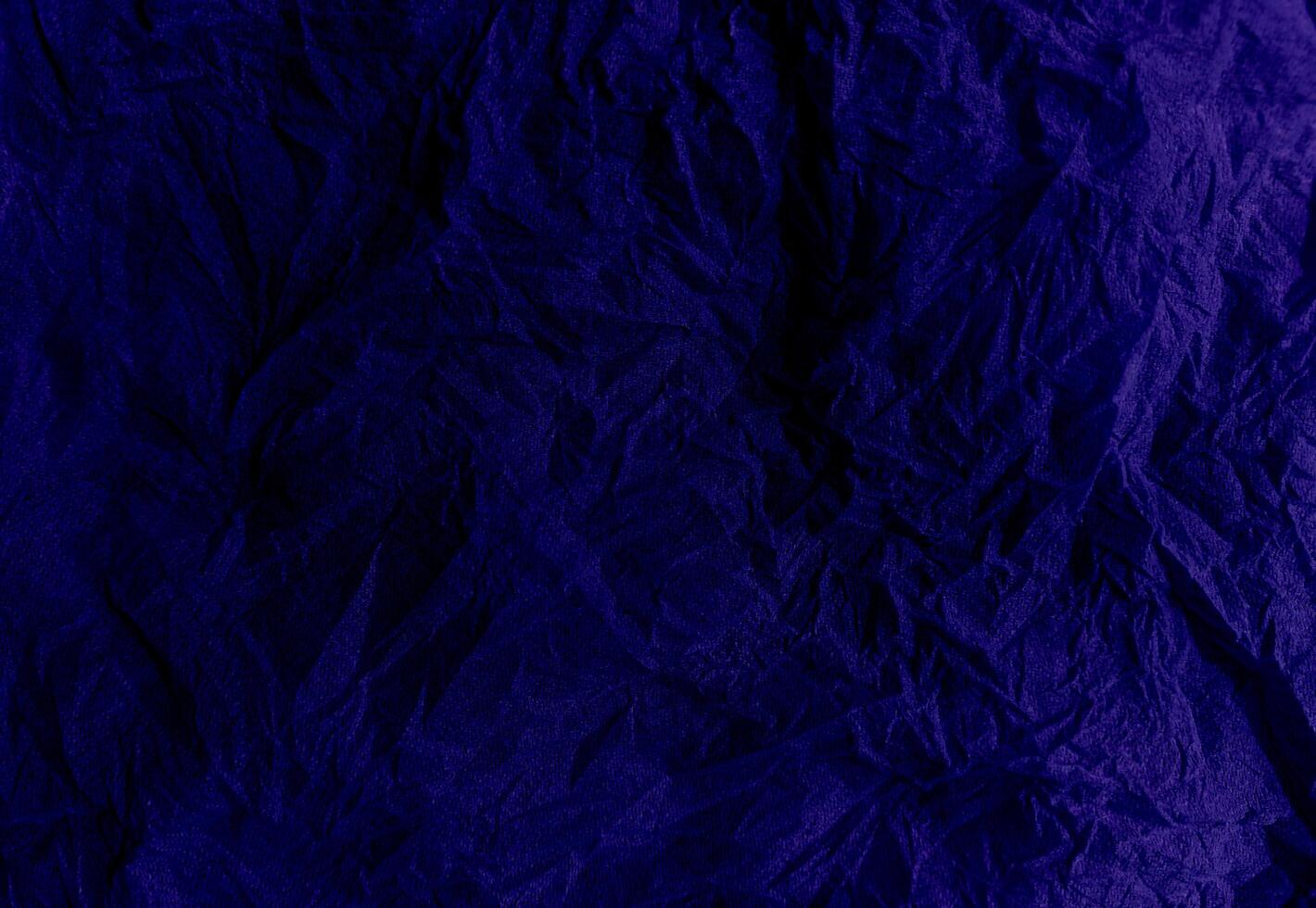 Abstract creased or wrinkled or crumbled paper texture background, Old and stained paper with grainy and wrinkled or crumbled stains. photo