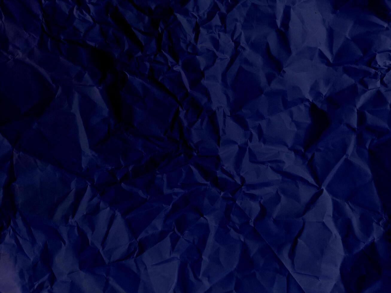 Abstract creased or wrinkled or crumbled paper texture background, Old and stained paper with grainy and wrinkled or crumbled stains. photo