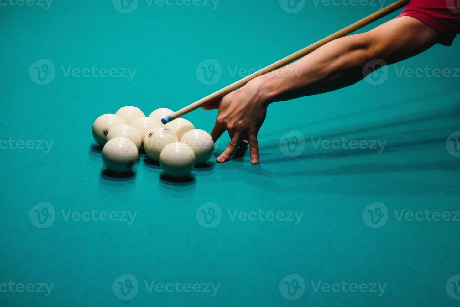 Playing billiard - Close-up shot of a man playing billiard photo
