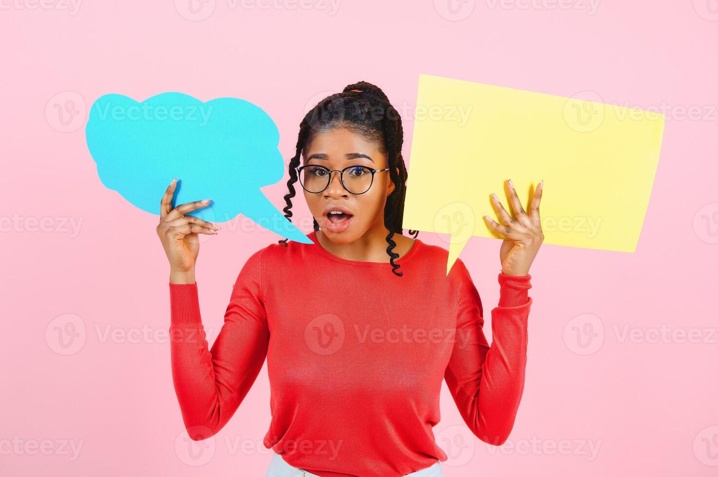 I Think. Pensive afro woman looking at blank speech bubble, touching her chin, copyspace, pink studio wall. photo