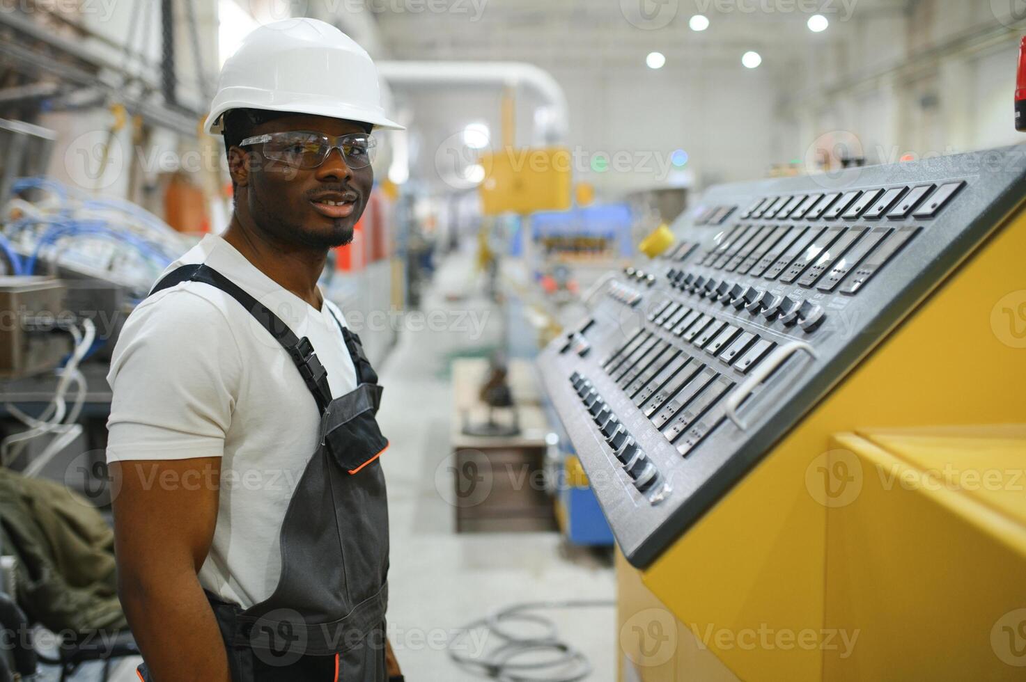 Factory for aluminum and PVC windows and doors production. Manual worker assembling PVC windows and doors photo
