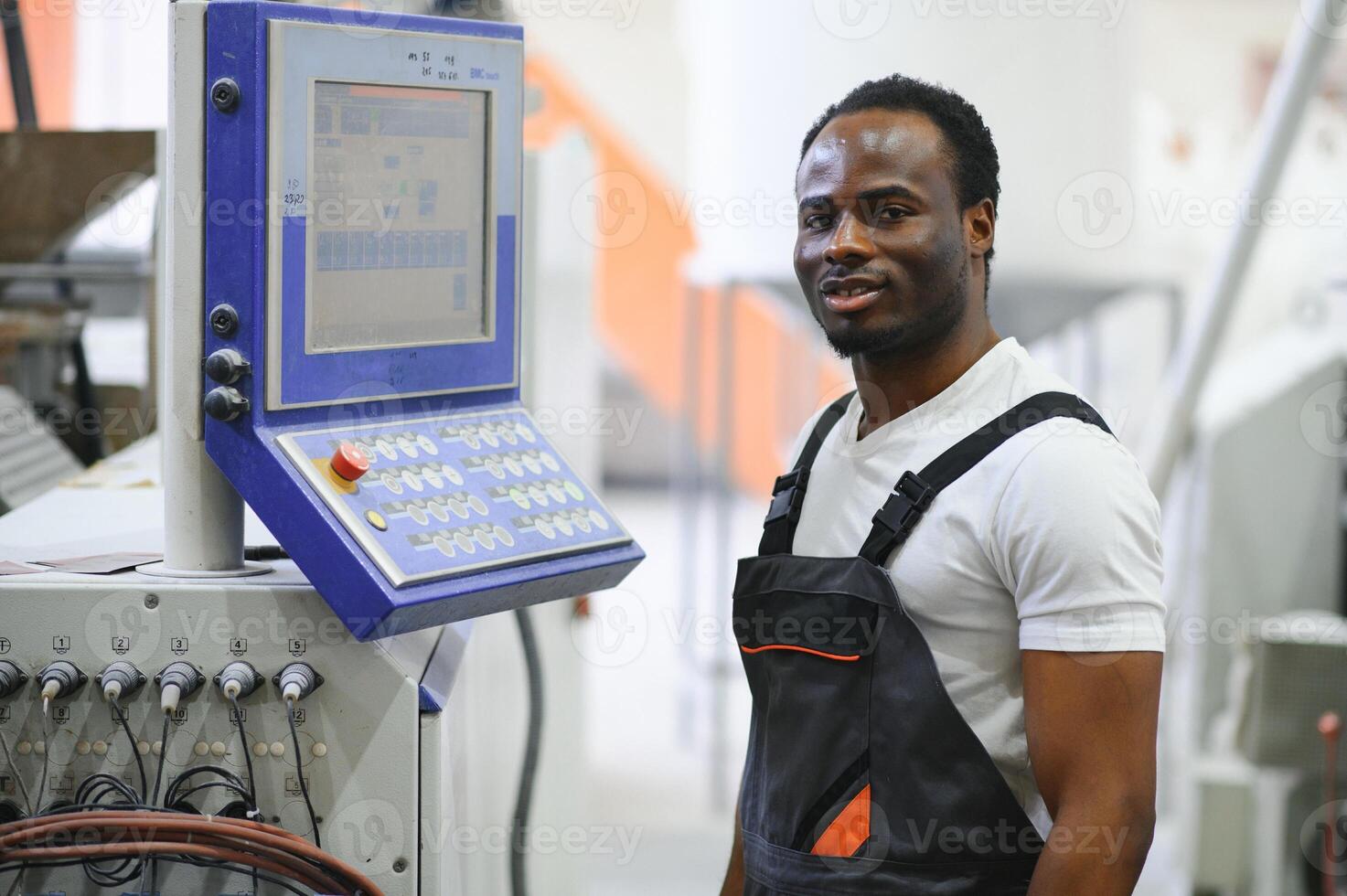Factory for aluminum and PVC windows and doors production. Manual worker assembling PVC windows and doors photo