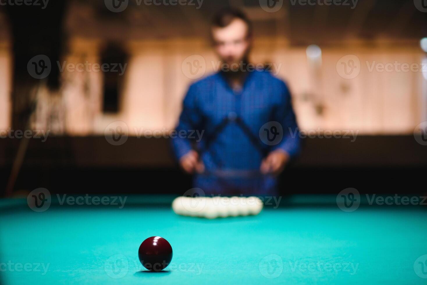 Playing billiard - Close-up shot of a man playing billiard photo