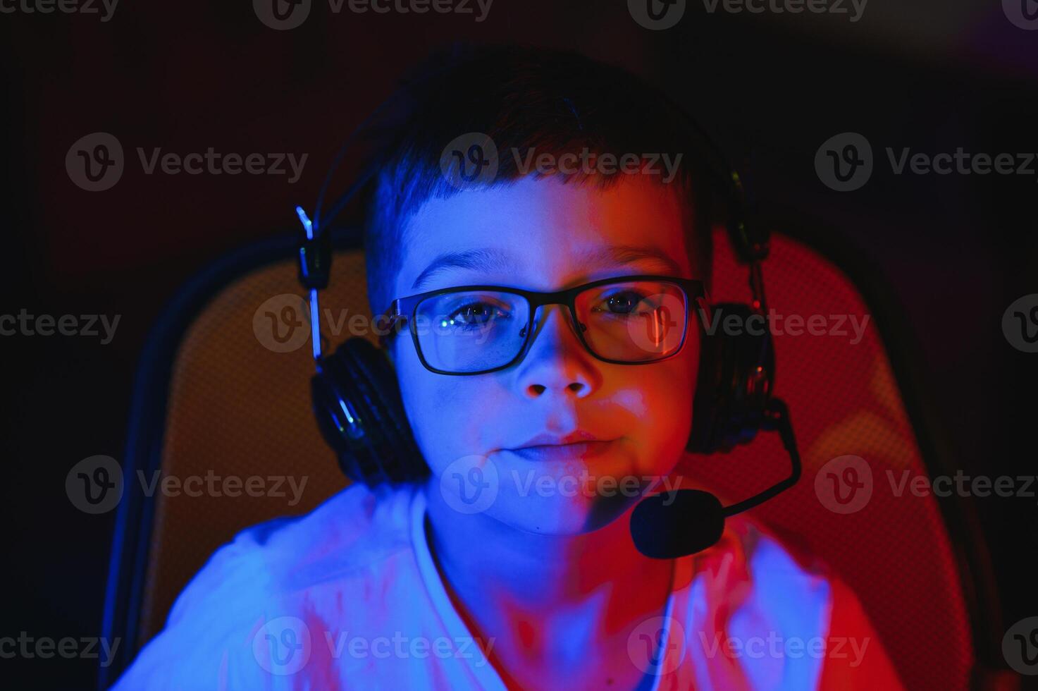 young man playing computer games on line photo