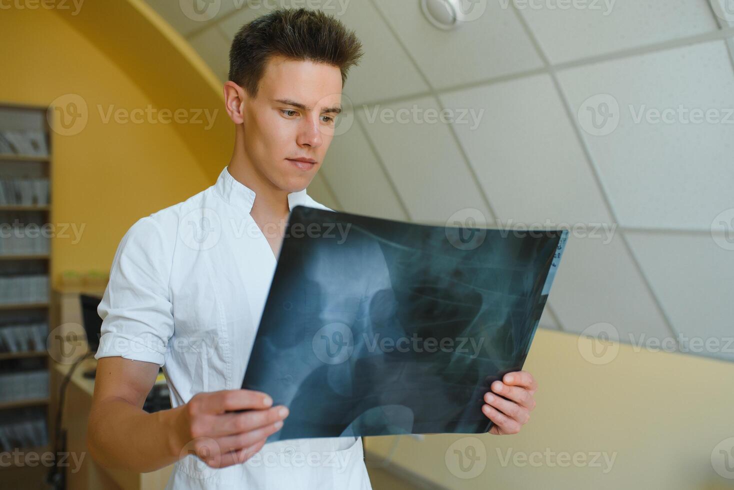 hospital doctor holding patient's x-ray film photo