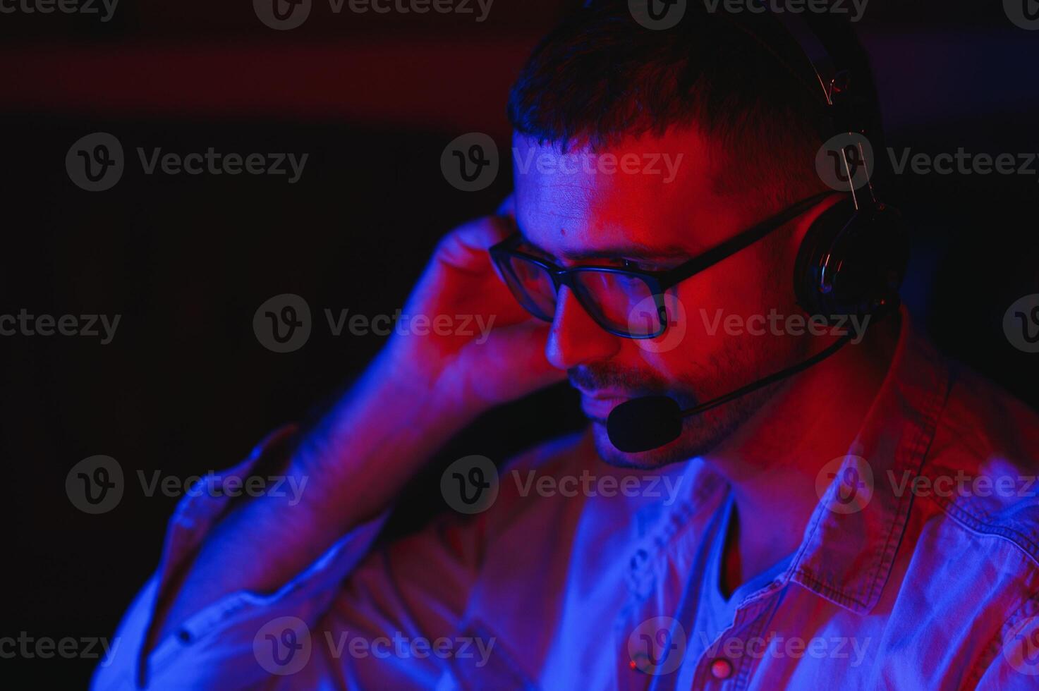 young man playing computer games on line photo