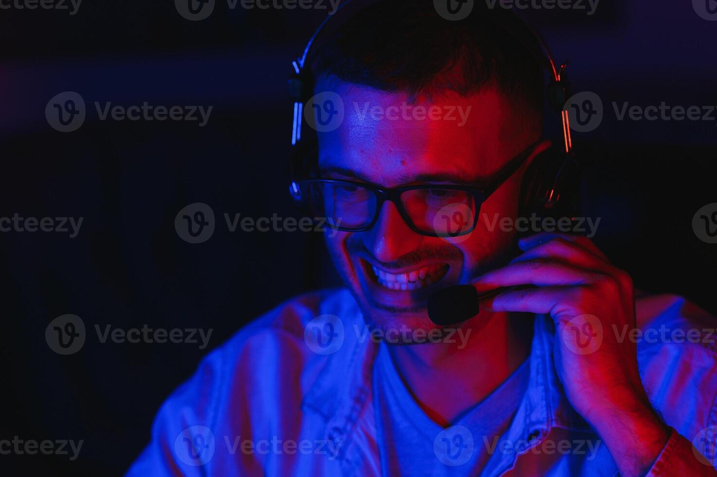 young man playing computer games on line photo