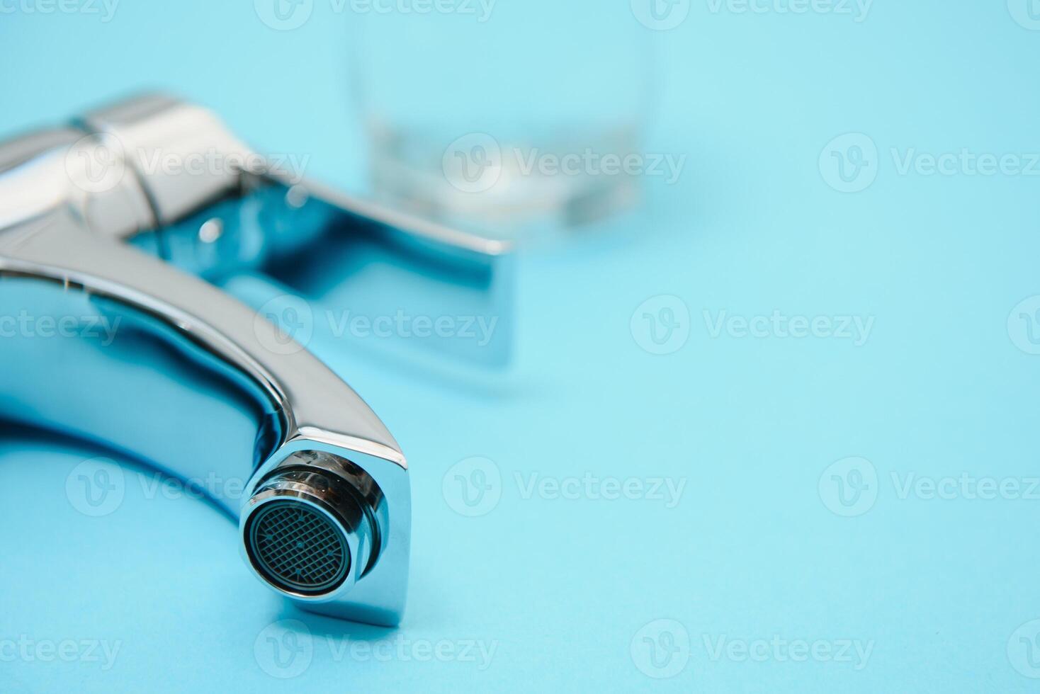 Single handle water tap on light blue background, closeup photo