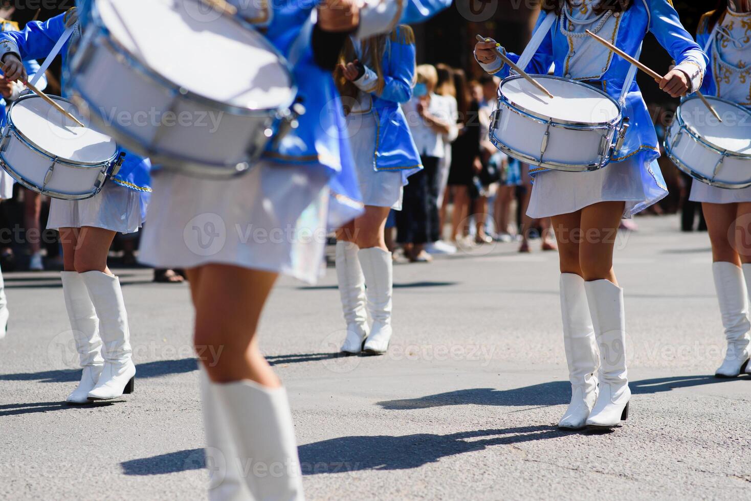 group of majorettes parade through the streets of the city photo