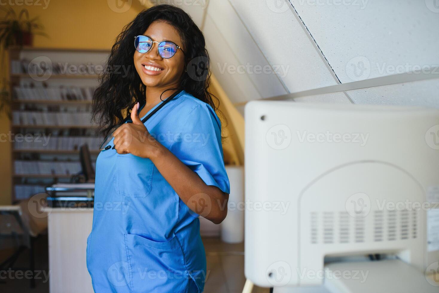 portrait of african female doctor at workplace photo