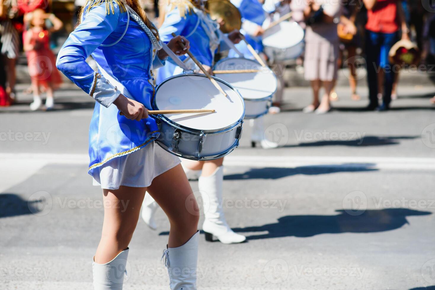 group of majorettes parade through the streets of the city photo