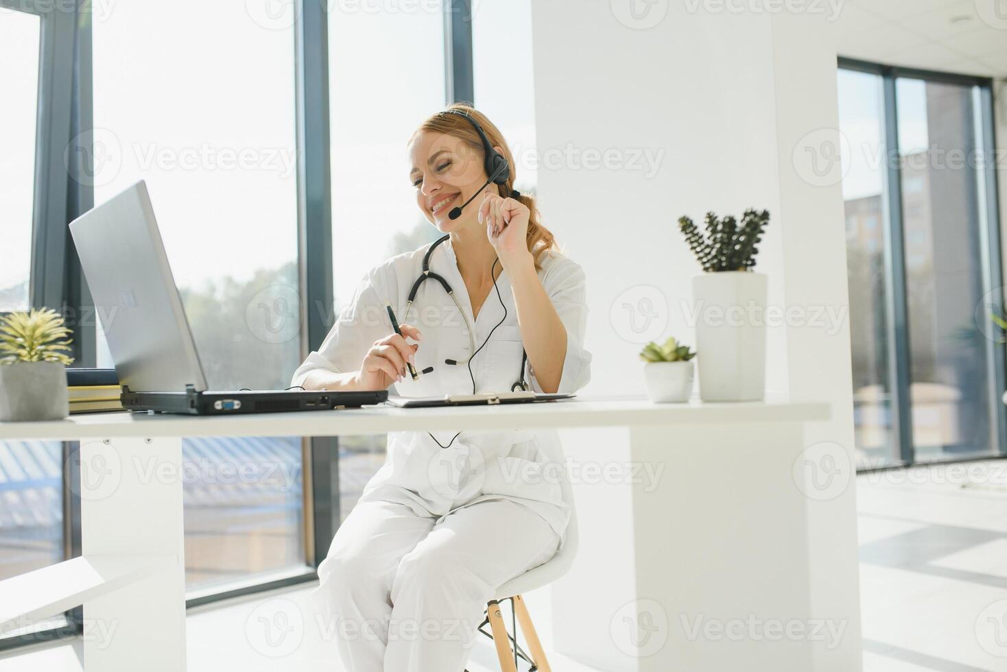 doctor talking with sick person through laptop online system and using mobile digital tablet computer searching patient medical records on the database files document photo