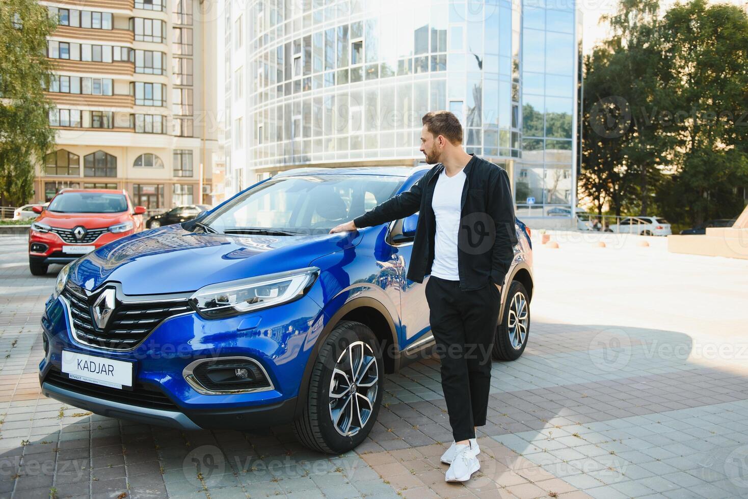 successful man near his car photo