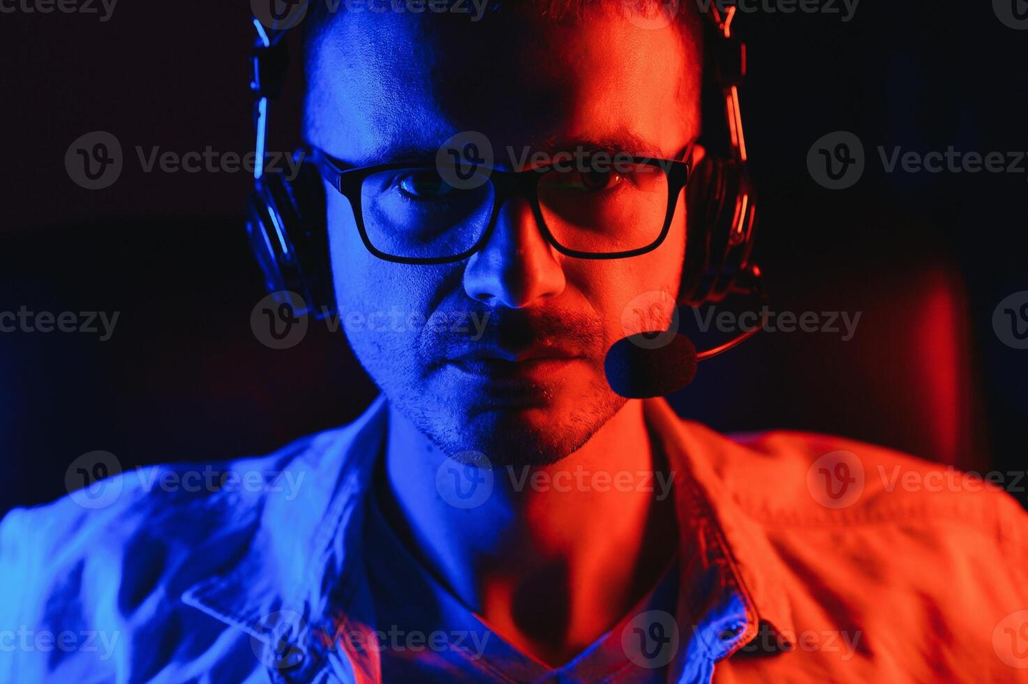 young man playing computer games on line photo