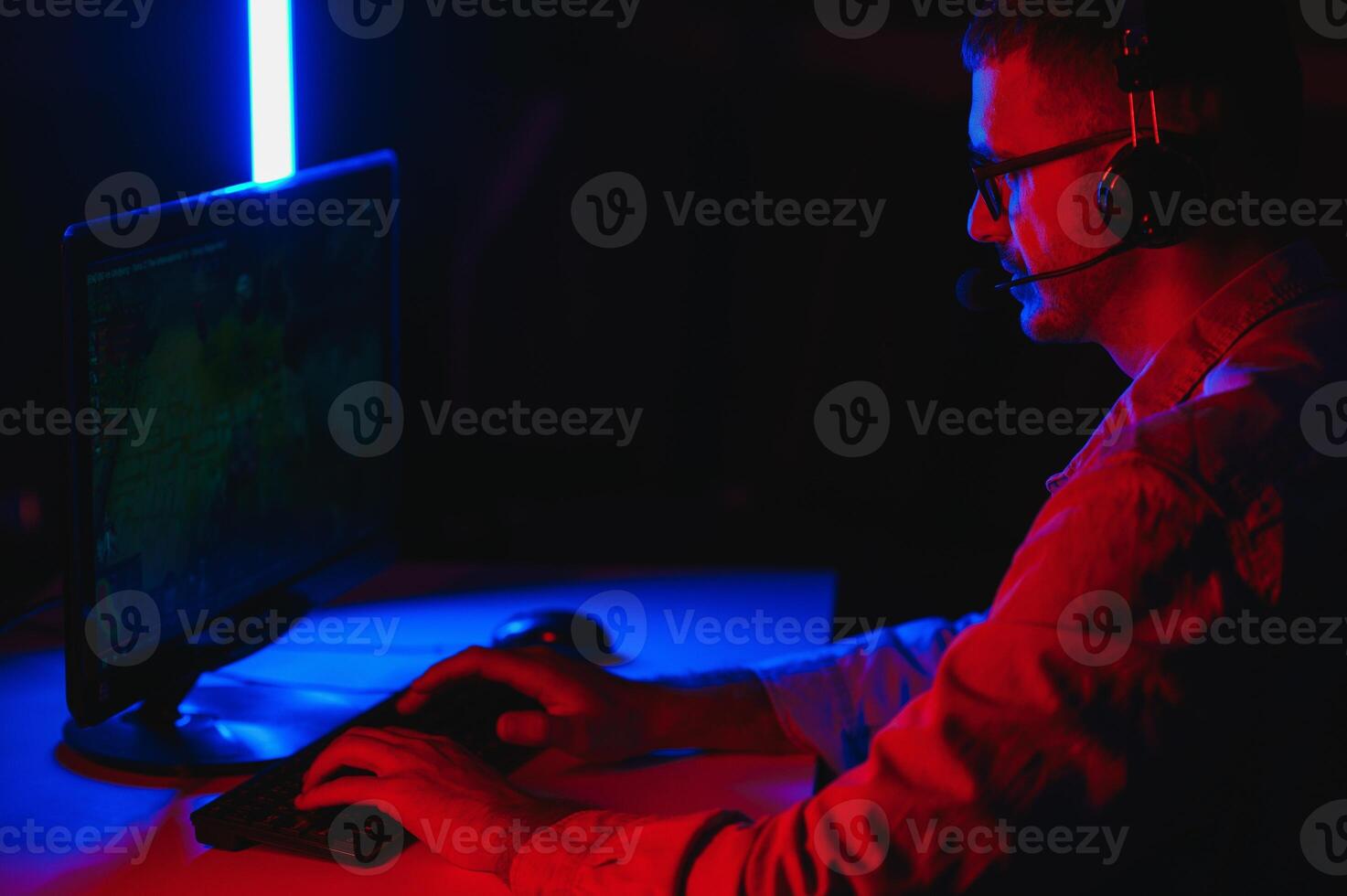 Handsome young male software developer programming codes while working from home photo