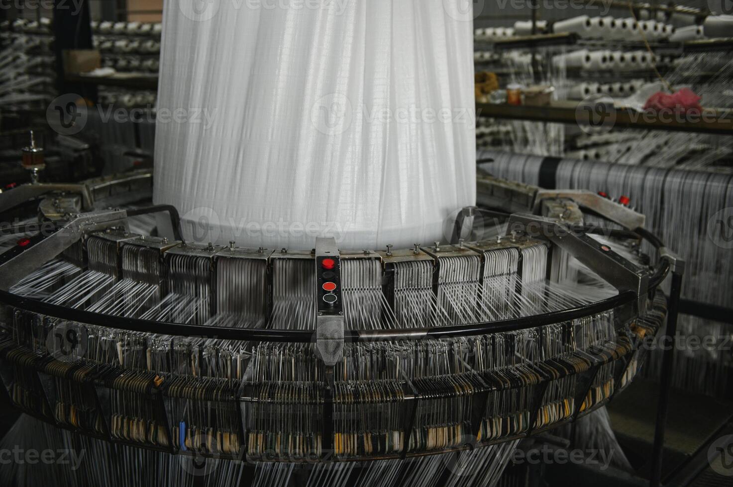 Industrial fabric production line. Weaving looms at a textile factory photo