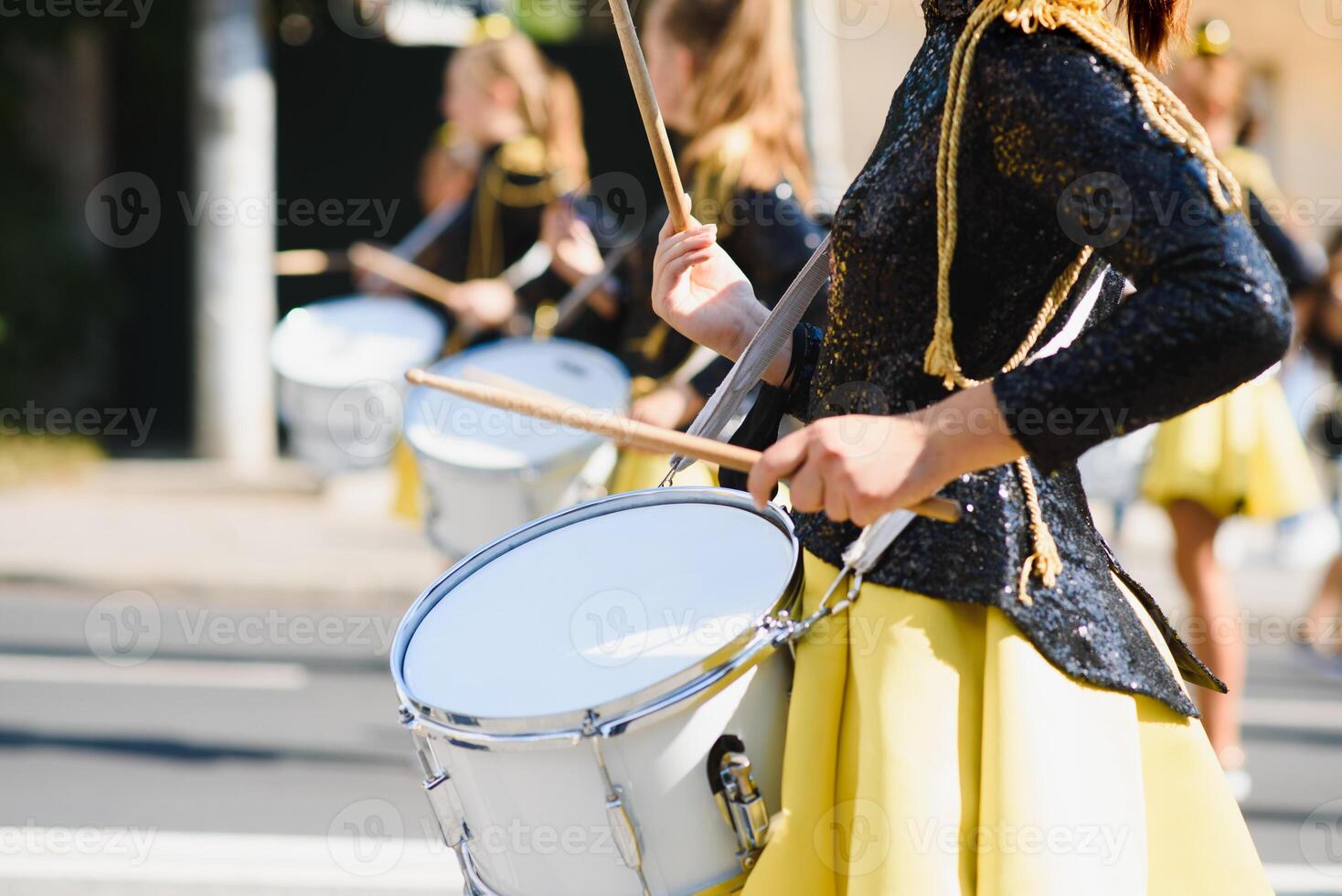 majorettes with white and blue uniforms perform in the streets of the city. photographic series photo