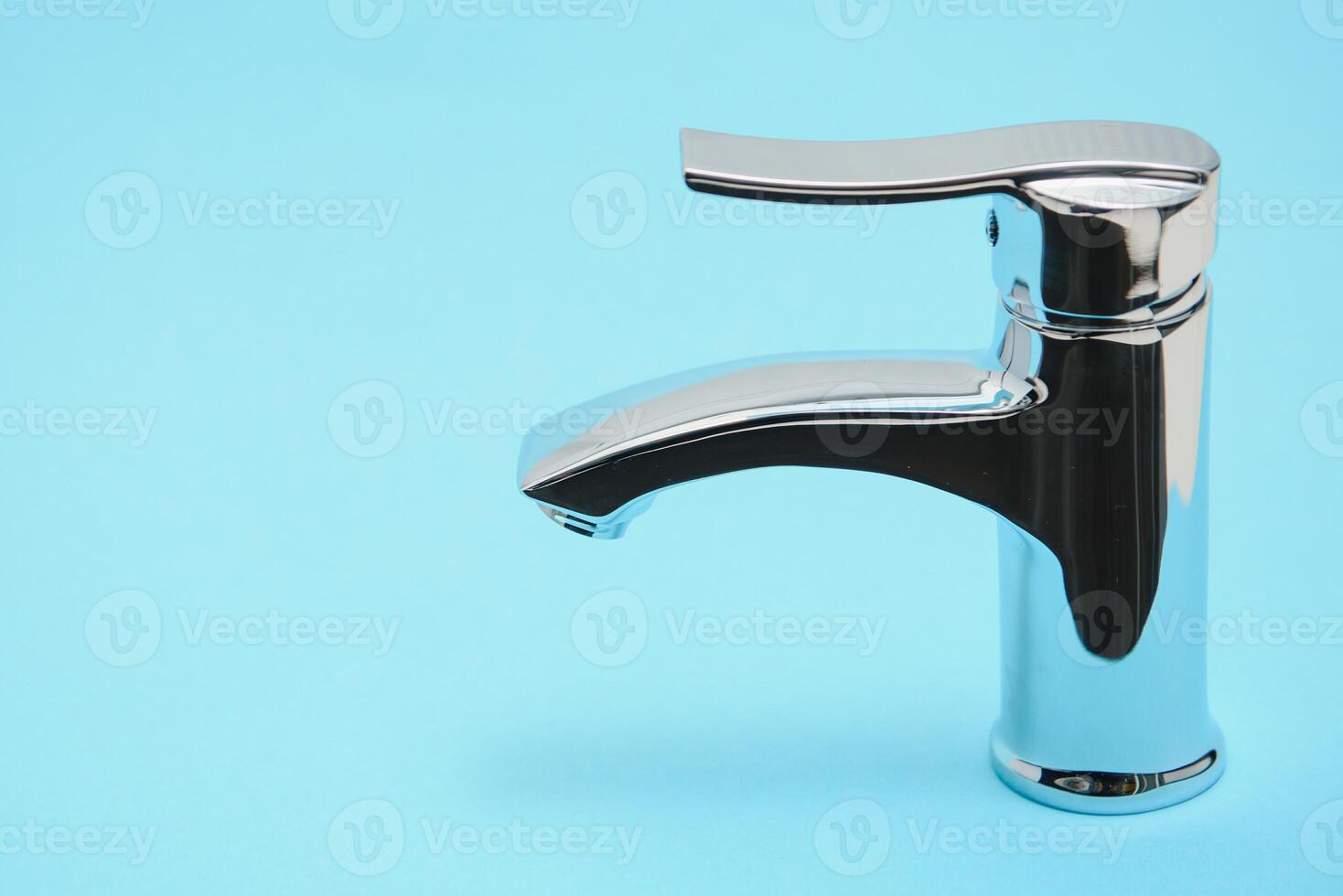 Single handle water tap on light blue background, closeup photo