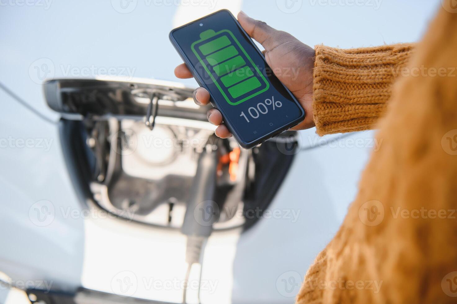 Phone charging in car concept, close up image of smart phone charger in car dashboard photo