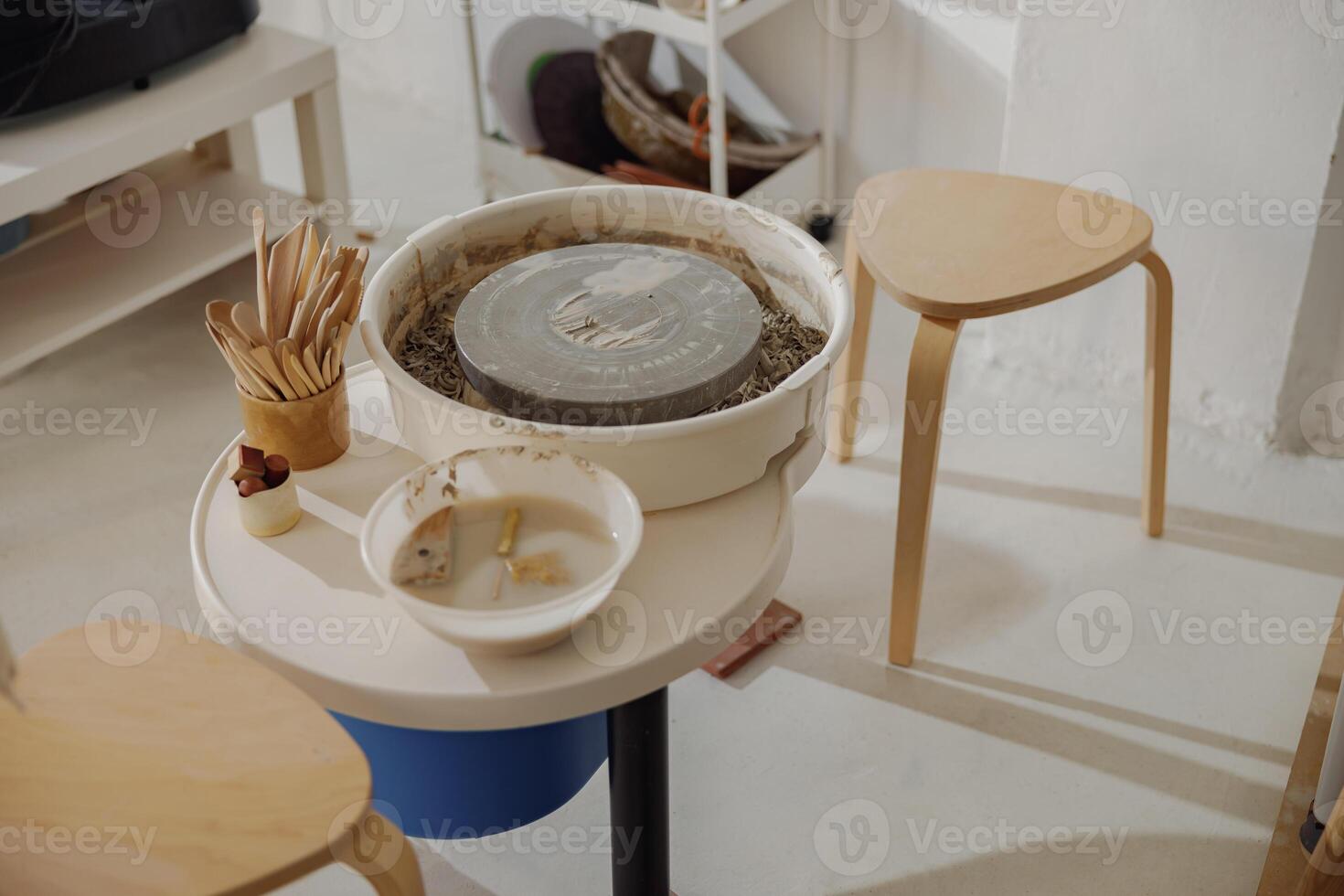 Professional pottery equipment such as spinning pottery tool in ceramic workshop photo