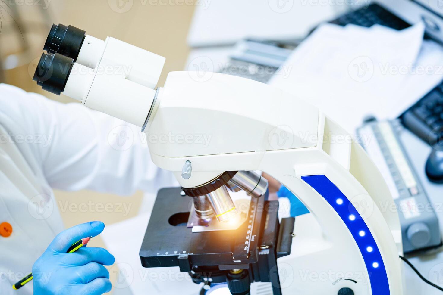 Microscope in laboratory. Scientific and medical research concept. Study under the microscope in the laboratory. photo
