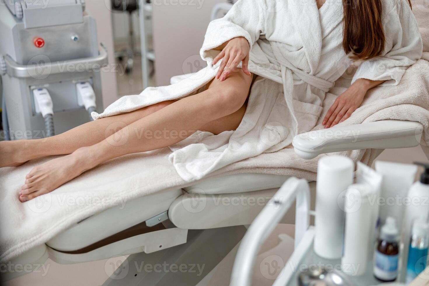 Perfect smooth legs of woman in spa center after beauty procedures photo