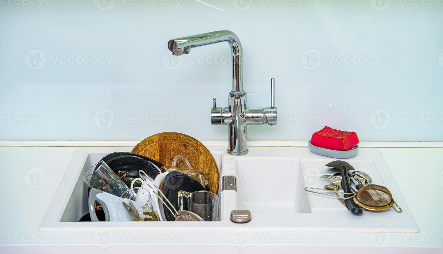 Dirty dishes. Plates and kitchen utensils after dinner. Kitchen sink with dirty plates. photo