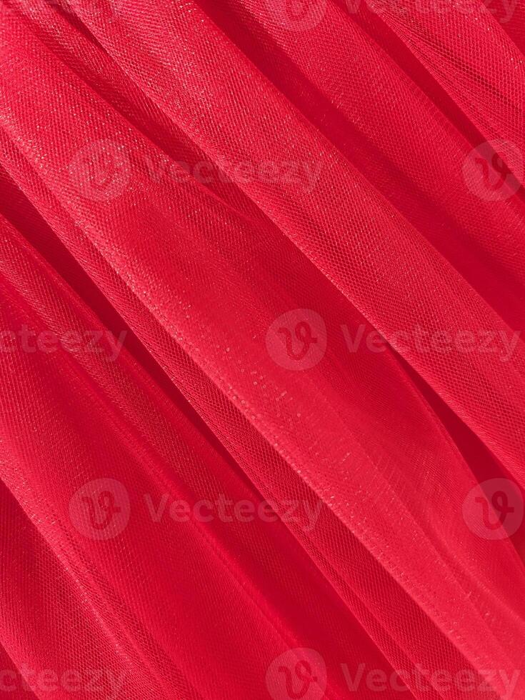 Red mesh fabric. Red fabric background. Factory texture photo