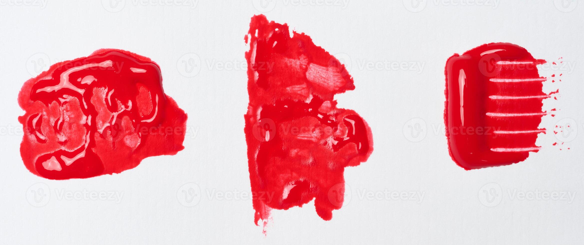 Watercolor brush stroke of red paint on a white isolated background photo