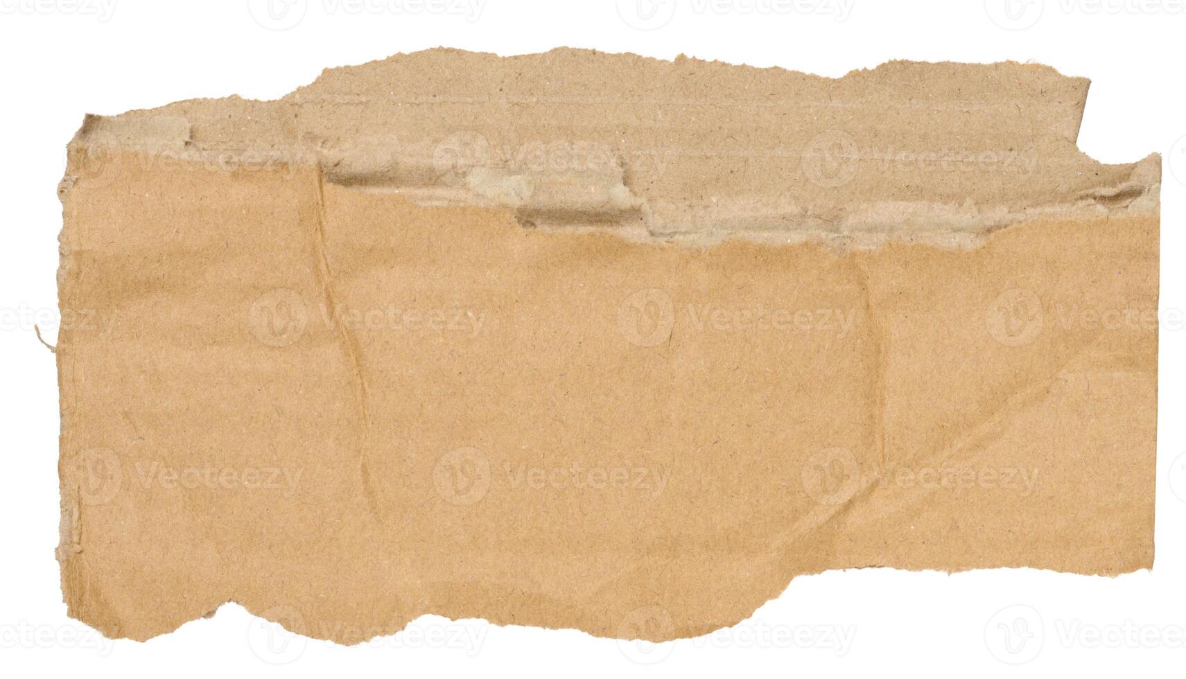 Piece of brown cardboard with torn edges on isolated background photo