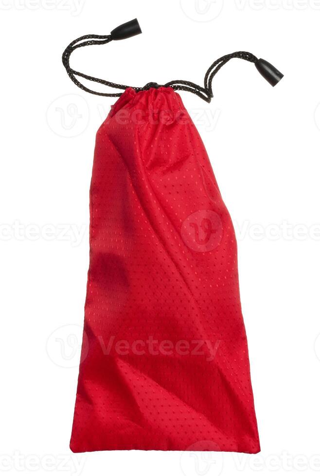 Red textile bag with black ropes on isolated background photo