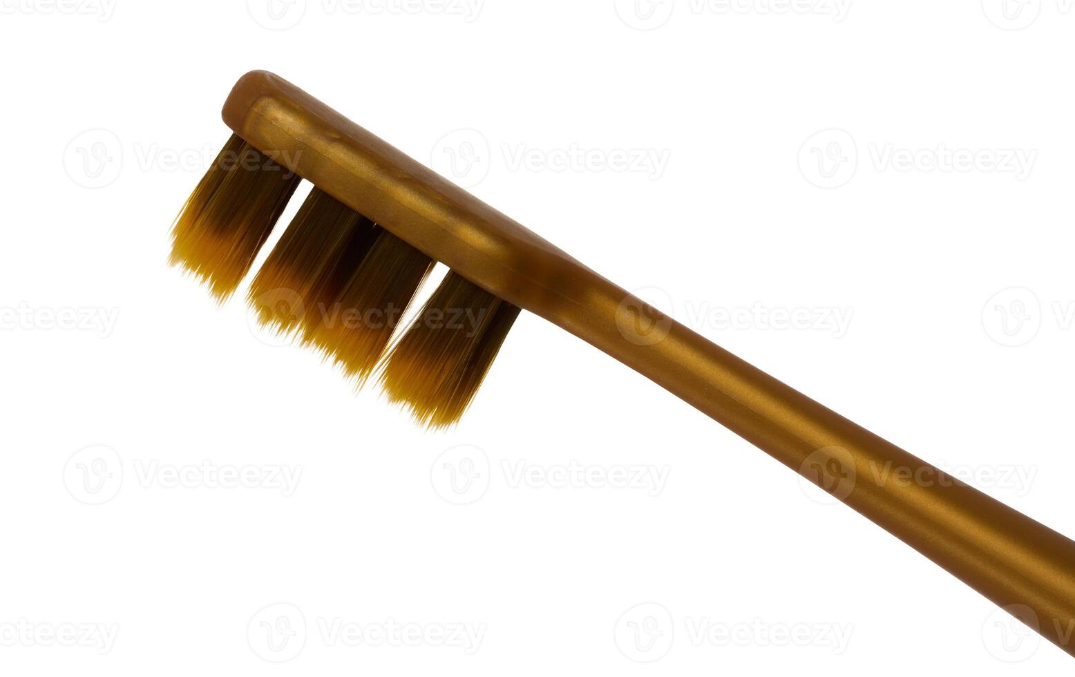 Brown plastic toothbrush on isolated background, close up photo